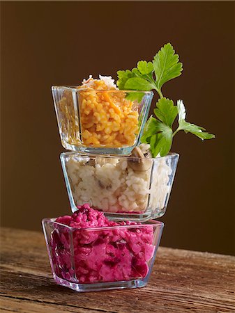 Three types of risotto in glass bowls stacked on top of one another Stock Photo - Premium Royalty-Free, Code: 659-06902353