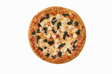 simsearch:659-07068969,k - Whole Spinach and Feta Cheese Pizza on a White Background; From Above Photographie de stock - Premium Libres de Droits, Code: 659-06902906