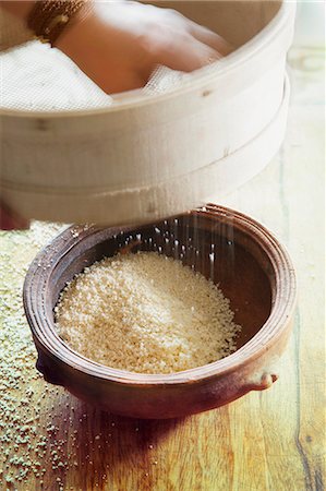 strainer - Couscous being sieved Stock Photo - Premium Royalty-Free, Code: 659-06902993