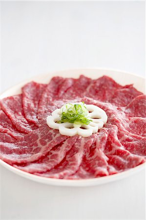 Wagyu beef with lotus root and sliced spring onions Stock Photo - Premium Royalty-Free, Code: 659-06903228