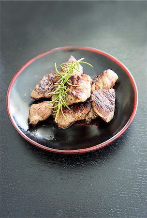 Wagyu beef, roasted, with rosemary Stock Photo - Premium Royalty-Free, Code: 659-06903223