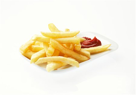 Chips with ketchup against a white background Foto de stock - Royalty Free Premium, Número: 659-06903283