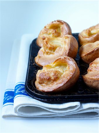 Yorkshire puddings in the baking tin Stock Photo - Premium Royalty-Free, Code: 659-06903313