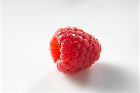 raspberries - A raspberry Stock Photo - Premium Royalty-Free, Code: 659-06903419