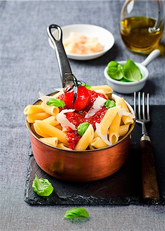 simsearch:659-07610171,k - Penne with tomato sauce, basil and parmesan Stock Photo - Premium Royalty-Free, Code: 659-06903446