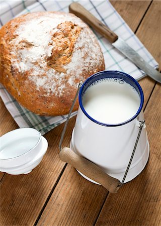 A fresh loaf of bread and a can of milk Stock Photo - Premium Royalty-Free, Code: 659-06903597
