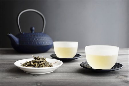 Two Cups of Green Tea, loose Tea and Japanese Teapot, selective focus Stock Photo - Premium Royalty-Free, Code: 659-06903935