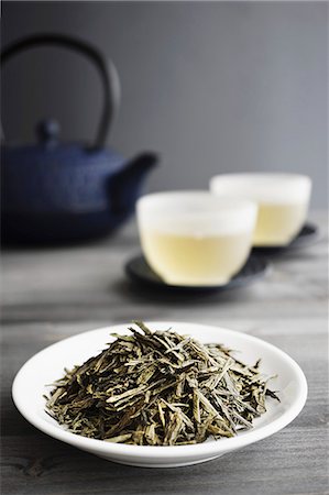 Loose Green Tea, Two Cups of Tea and Japanese Teapot, selective focus Stock Photo - Premium Royalty-Free, Code: 659-06903936