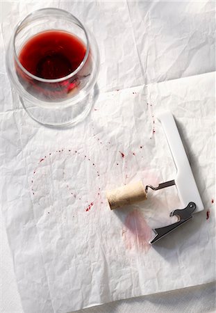 simsearch:640-05761233,k - Half Empty Glass of Red Wine with Corkscrew and Wine Stains on Paper Stock Photo - Premium Royalty-Free, Code: 659-07026862