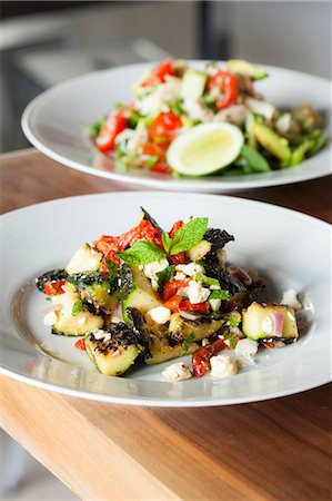 Mediterranean Zucchini Salad with Red Peppers, Red Onion and Feta Cheese; Crab Salad in Background Photographie de stock - Premium Libres de Droits, Code: 659-07026894