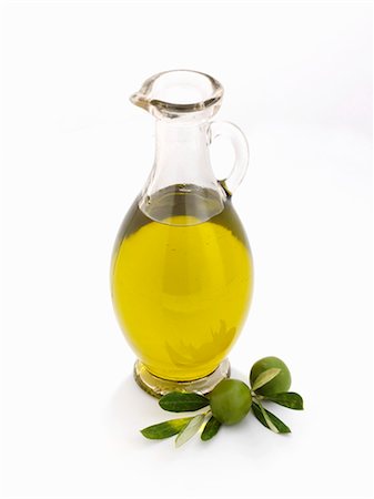 simsearch:659-06495683,k - A glass carafe of olive oil against a white background Stock Photo - Premium Royalty-Free, Code: 659-07026985