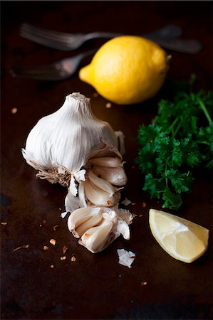 food black background - Fresh Garlic, Lemon and Parsley Stock Photo - Premium Royalty-Free, Code: 659-07027035