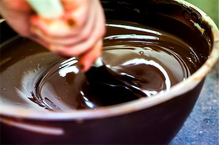 Melted chocolate being stirred Stock Photo - Premium Royalty-Free, Code: 659-07027112