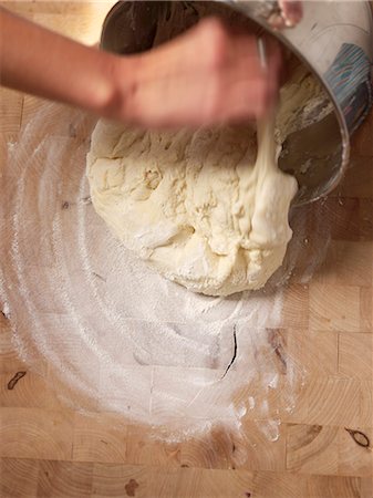 simsearch:659-06187784,k - Making Bread; Dumping Dough from Pan onto Floured Surface Stock Photo - Premium Royalty-Free, Code: 659-07027132