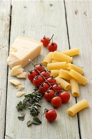 Pasta, tomatoes, oregano and Grana Padano cheese Stock Photo - Premium Royalty-Free, Code: 659-07027151