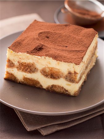 savoiardi - A piece of tiramisu on a plate Stock Photo - Premium Royalty-Free, Code: 659-07027209