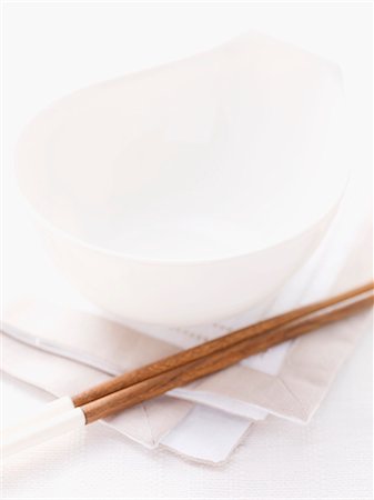 dishware - Table setting with bowl and chopsticks on a napkin (Asia) Stock Photo - Premium Royalty-Free, Code: 659-07027243