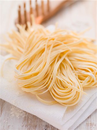 pasta - Home-made ribbon pasta on kitchen roll Stock Photo - Premium Royalty-Free, Code: 659-07027253