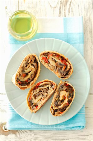 sliced mushroom - Four slices of mushroom strudel with peppers Stock Photo - Premium Royalty-Free, Code: 659-07027288