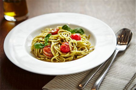 pasta noodle photographic - Spaghetti with tomatoes and pesto Stock Photo - Premium Royalty-Free, Code: 659-07027336