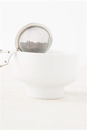 sieve - A tea strainer balanced on a white tea bowl Stock Photo - Premium Royalty-Free, Code: 659-07027534