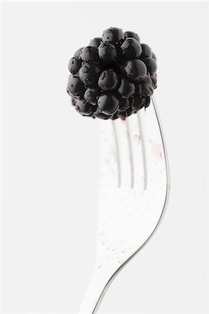 rubus - A blackberry stuck on a fork Stock Photo - Premium Royalty-Free, Code: 659-07027530