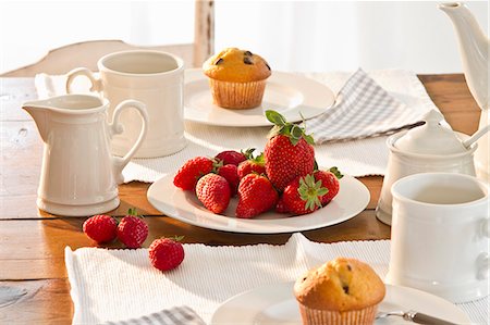 fragaria x ananassa - A table laid for coffee with muffins and fresh strawberries Stock Photo - Premium Royalty-Free, Code: 659-07027651