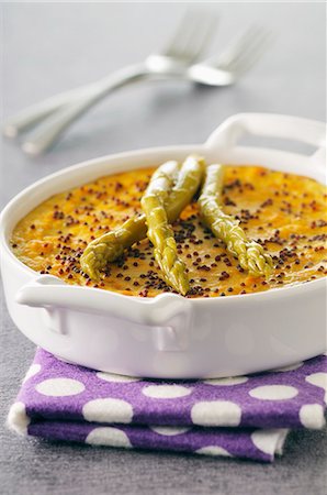 pictures of green food as appetizers - Carrot custard flan with poppy seeds and green asparagus Stock Photo - Premium Royalty-Free, Code: 659-07027768