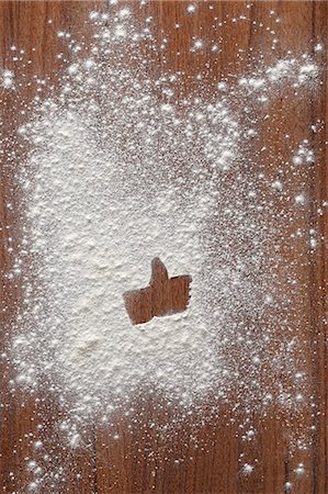 flour hands - A 'like' symbol in flour on a wooden surface Stock Photo - Premium Royalty-Free, Code: 659-07027822