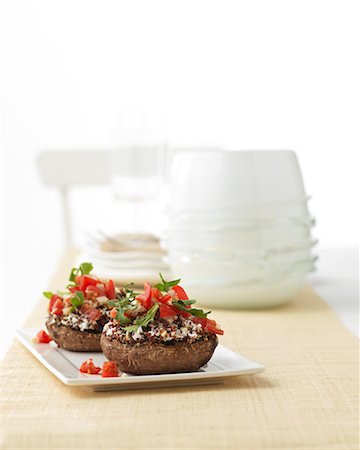 portobella - Stuffed mushrooms with tomatoes and rocket Stock Photo - Premium Royalty-Free, Code: 659-07027837