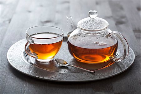 Tea in glass cup and pot Stock Photo - Premium Royalty-Free, Code: 659-07027976
