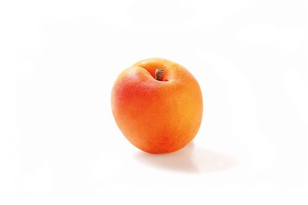 stone fruit - An apricot against a white background Stock Photo - Premium Royalty-Free, Code: 659-07028097