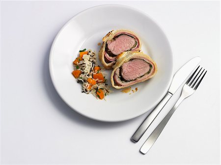 pork meat - Pork fillet wrapped in puff pastry and served with rice Stock Photo - Premium Royalty-Free, Code: 659-07028190