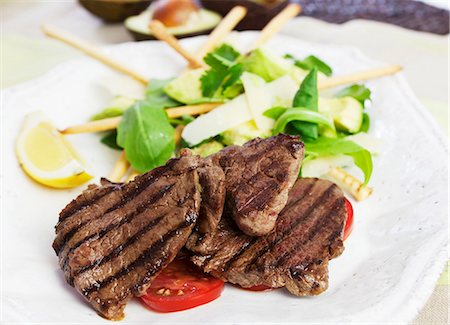 simsearch:659-06903721,k - Barbecued beef steaks with avocado salad Stock Photo - Premium Royalty-Free, Code: 659-07028227