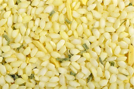 rice type - Vialone Nano risotto rice with almonds, lemon oil, turmeric and chives (filling the image) Stock Photo - Premium Royalty-Free, Code: 659-07028518