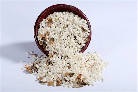 simsearch:659-07069655,k - Vialone Nano risotto rice with dried porcini mushrooms, pink peppercorns and parsley Stock Photo - Premium Royalty-Free, Code: 659-07028529