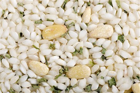 simsearch:659-06494925,k - Vialone Nano risotto rice with pine nuts and chives Stock Photo - Premium Royalty-Free, Code: 659-07028522