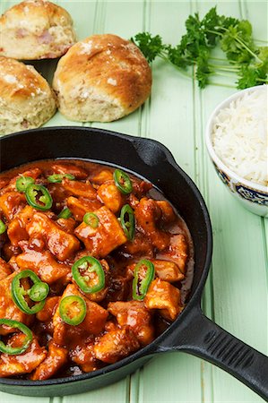 fry pan - Spicy turkey goulash in a pan, with rice and bread rolls Stock Photo - Premium Royalty-Free, Code: 659-07028648