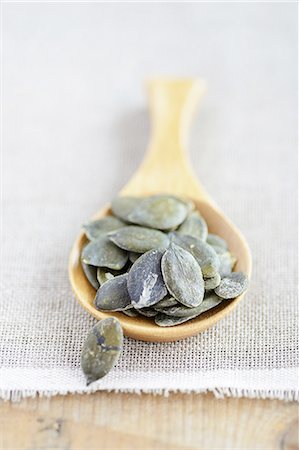 pumpkin seeds nutrition - Pumpkin seeds on a wooden spoon Stock Photo - Premium Royalty-Free, Code: 659-07028656