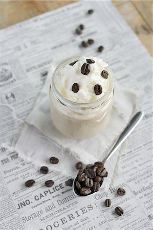 Latte topped with whipped cream in a screw-top jar, and coffee beans Stockbilder - Premium RF Lizenzfrei, Bildnummer: 659-07028653