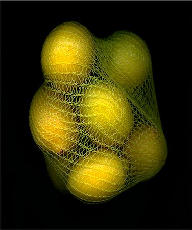 fruit cutout - Lemons in a net bag Stock Photo - Premium Royalty-Free, Code: 659-07028669