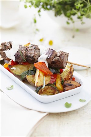 roasted (meat) - A lamb kebab with roasted vegetables Stock Photo - Premium Royalty-Free, Code: 659-07028802