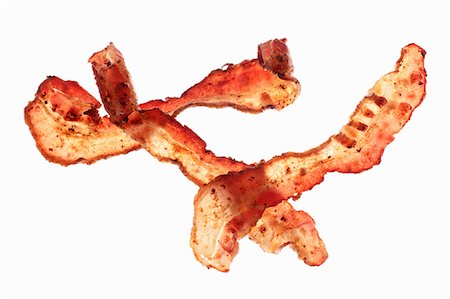 Three fried rashers of bacon Photographie de stock - Premium Libres de Droits, Code: 659-07028841