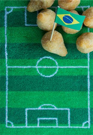 Salgadinhos (filled pastries, Brazil) with football-themed decoration Stock Photo - Premium Royalty-Free, Code: 659-07028919