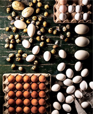 Assorted eggs on a wooden board Stock Photo - Premium Royalty-Free, Code: 659-07068503