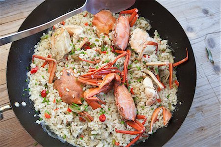 paella - Fried rice with crabs and vegetables Fotografie stock - Premium Royalty-Free, Codice: 659-07068559