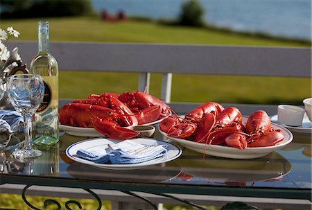 Platters of Cooked Lobsters on an Outdoor Table; White Wine Stock Photo - Premium Royalty-Free, Code: 659-07068550