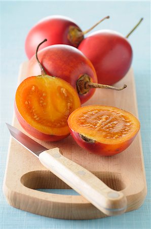 simsearch:659-06185894,k - Fresh tamarillos, whole and halved Stock Photo - Premium Royalty-Free, Code: 659-07068675