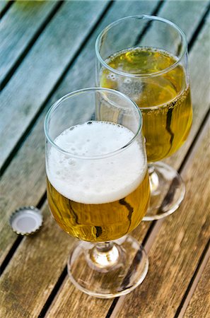 retro glasses - Beer glasses on a wooden table Stock Photo - Premium Royalty-Free, Code: 659-07068729