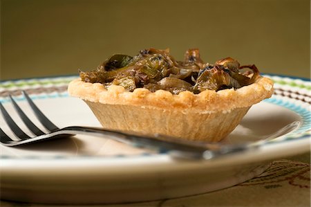 simsearch:659-06495240,k - A mushroom and leek tartlet Foto de stock - Sin royalties Premium, Código: 659-07068748